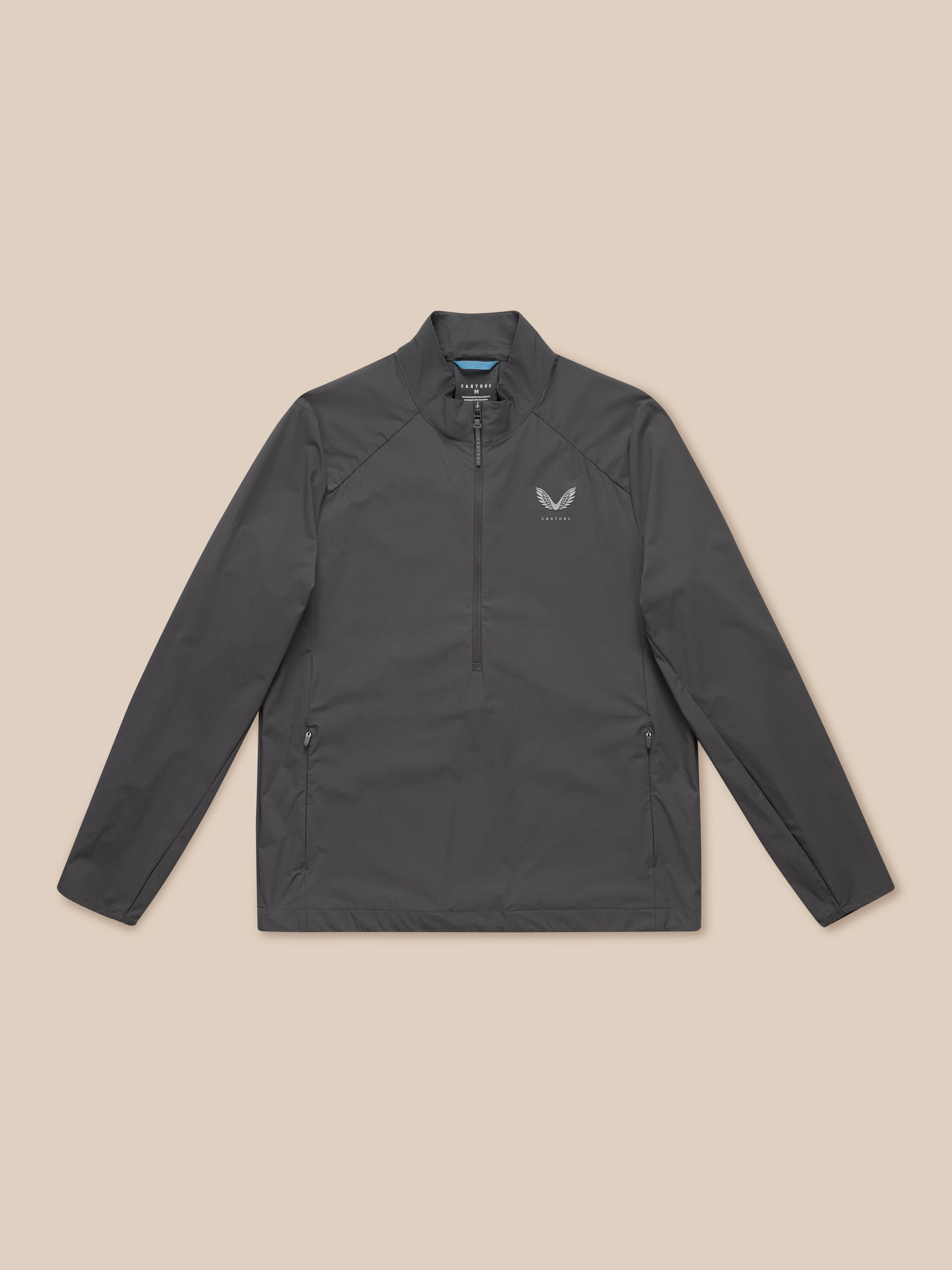Model wearing charcoal Golf Half Zip Top with stand collar and chest logo.