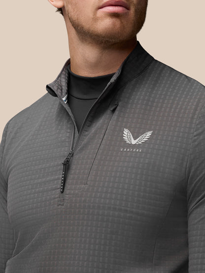Close up of grey Golf 1/2 Zip Top showing left chest Castore logo and half zip