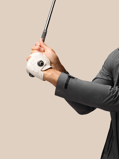 Front view of grey Golf Waterproof Jacket Gunmetal with stand collar and zip pockets worn by a model.