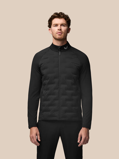 Male model wearing black Golf Pinnacle Jacket with quilted front panels and stand collar