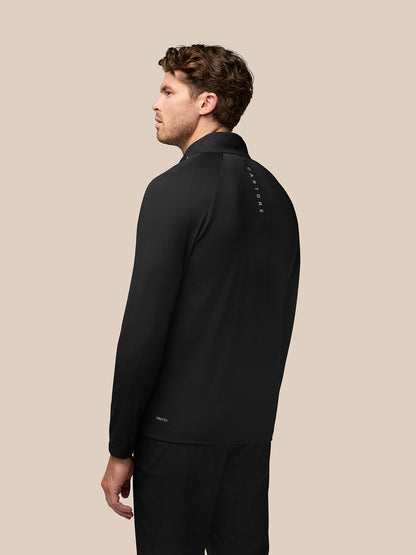 Back view of black Pinnacle Golf Jacket with vertical Castore branding along the back