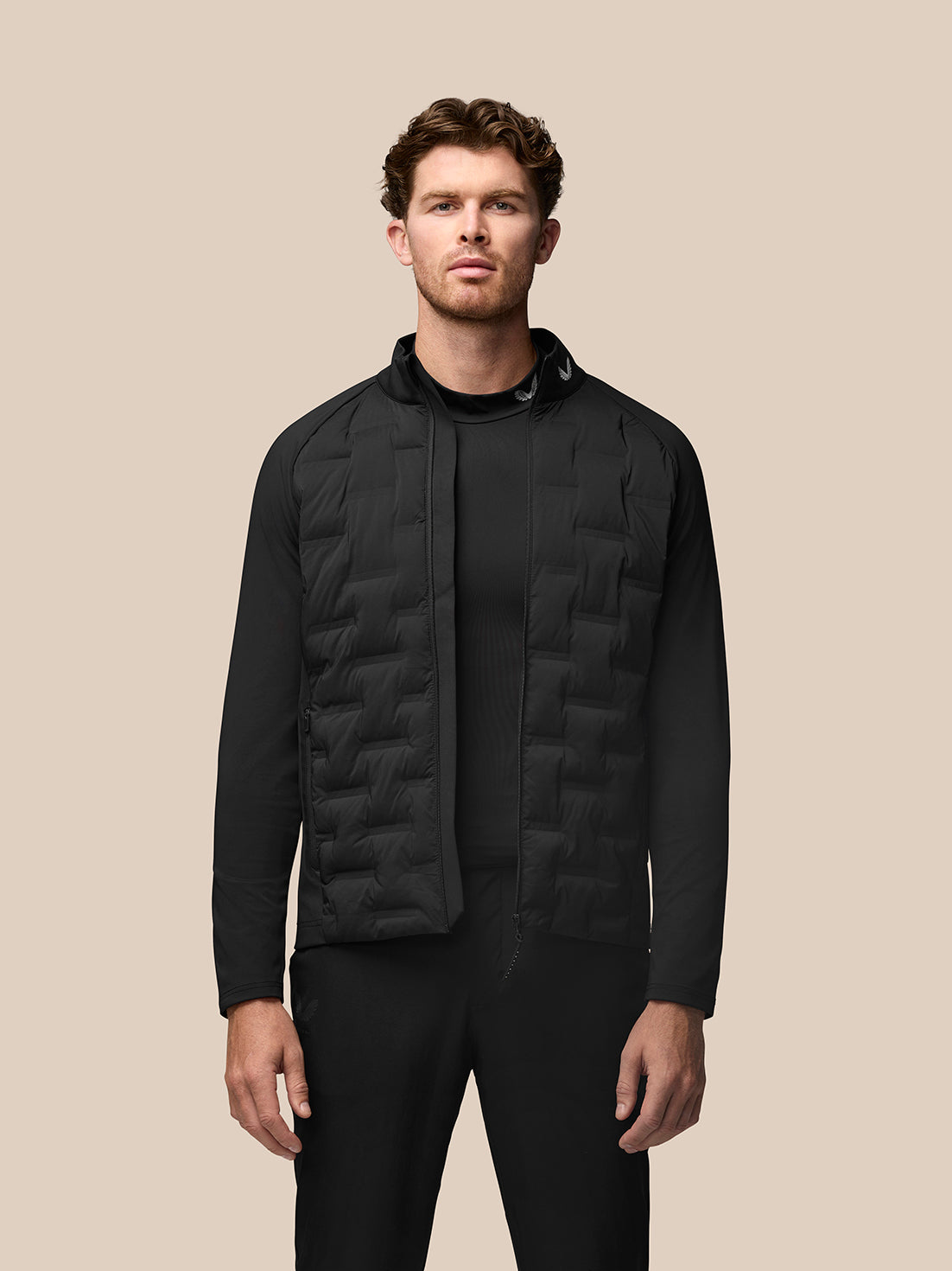 Black Pinnacle Golf Jacket with quilted front panels stand collar and Castore branding
