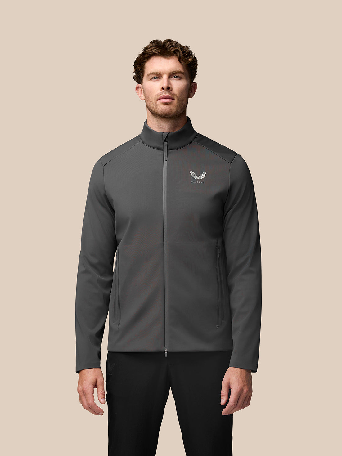 Male model wearing charcoal Garcia Hybrid Jacket with stand collar and front zip