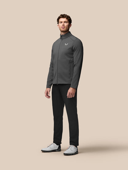 Male model wearing Garcia Hybrid Jacket in charcoal, showcasing stand collar and zip pockets.