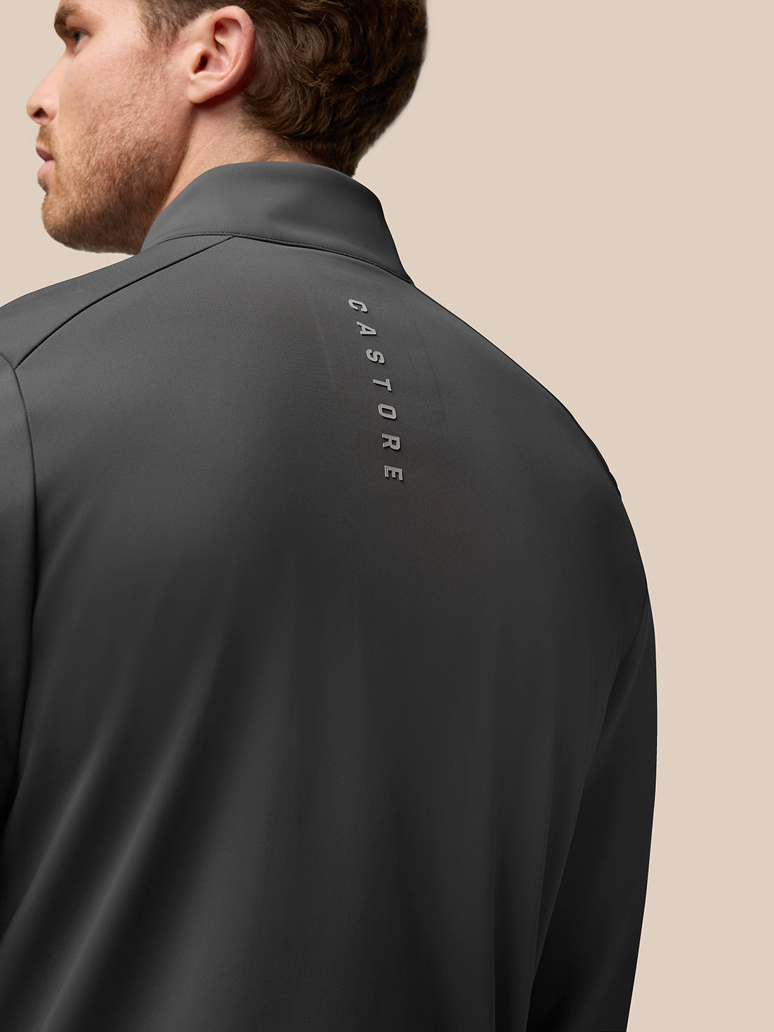 Back view of charcoal Garcia Hybrid Jacket with vertical CASTORE branding along the upper back.