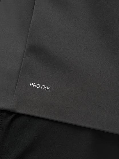 Close-up of the Garcia Hybrid Jacket fabric in charcoal with PROTEK branding.