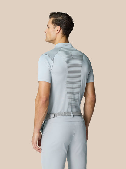 Man seen from behind wearing Pinnacle Golf LVS Polo in mid grey with vented back panel