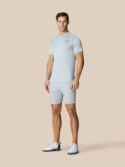 Full-body view of a male model in Pinnacle Golf LVS Polo in mid grey with matching shorts
