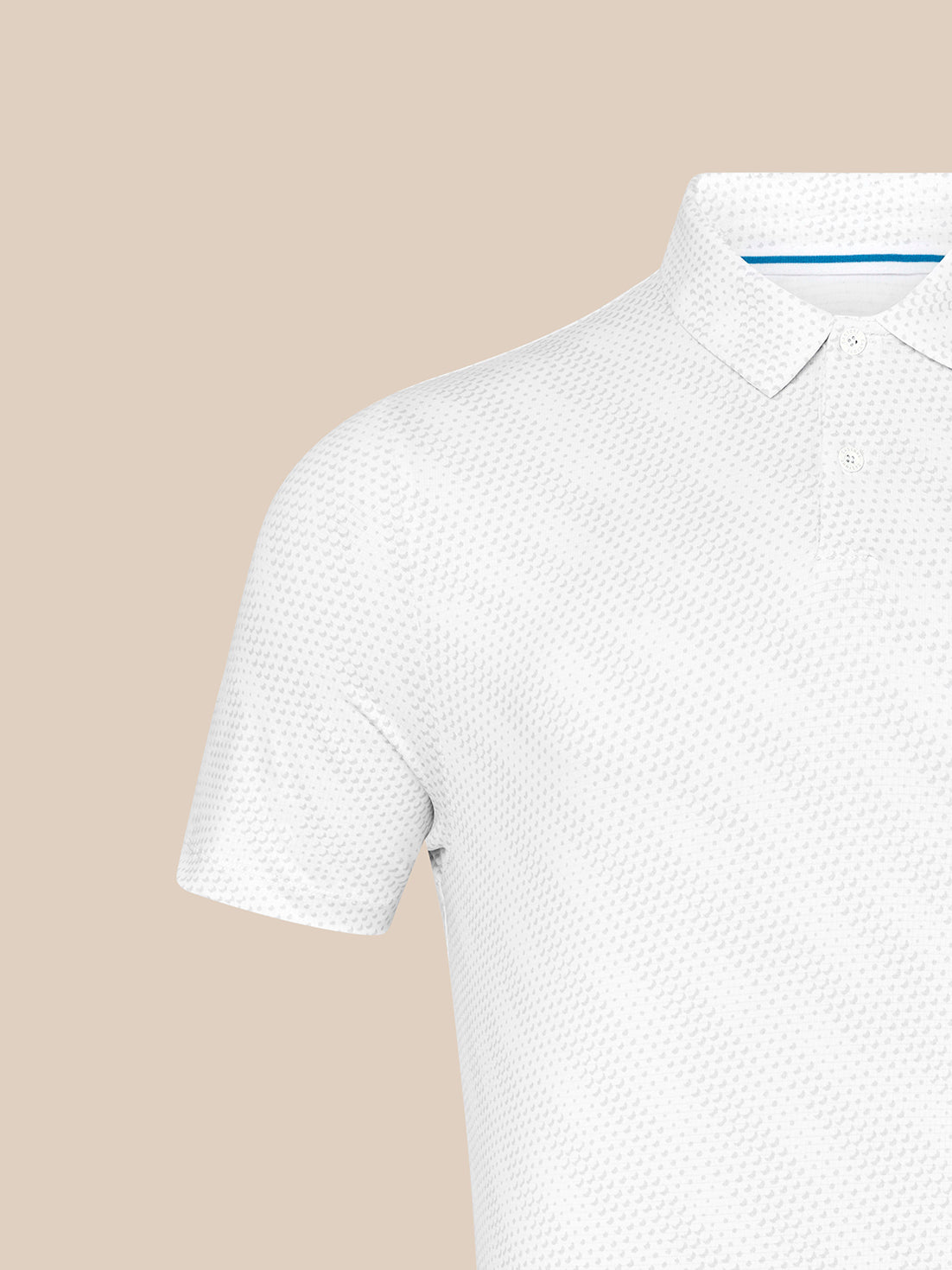 Close-up of shoulder and collar on white Majesticks polo with textured golf ball fabric