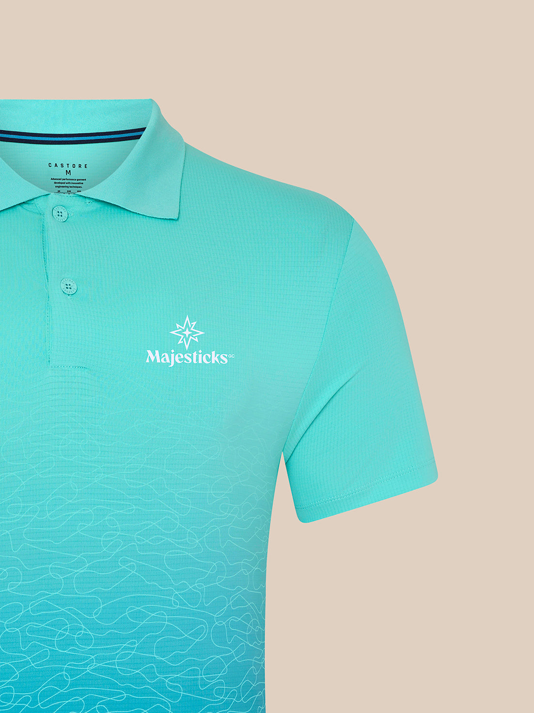 Light aqua Majesticks golf polo with ombre wave print and Castore branding on chest and upper back