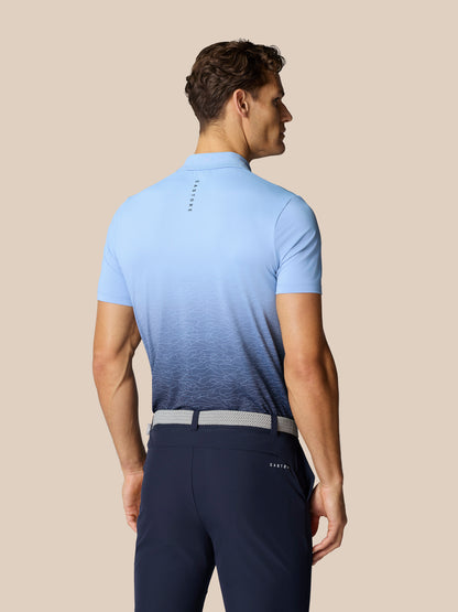 Back view of the sky blue Club Graphic Polo with gradient hem and Castore branding at upper back