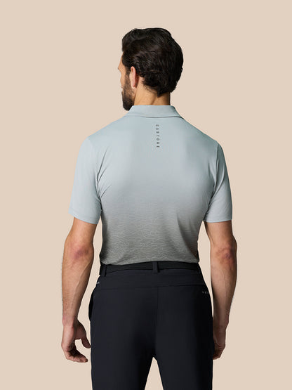 Back view of Club Graphic Polo in mid grey with gradient lower panel and Castore branding along the upper back.