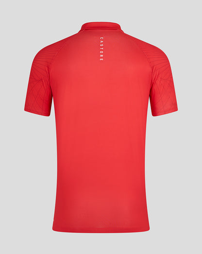 Back view of red Majesticks Golf Club polo with vertical Castore branding down the center