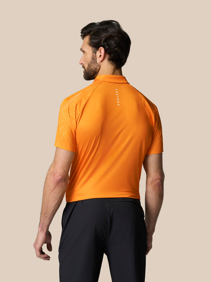 Back view of male model in bright orange Club Geo Print Polo with geometric shoulder pattern and vertical Castore branding on the upper back