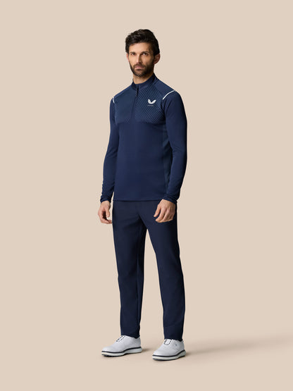 Front view of a man in navy Pinnacle LVS 1/4 Zip Top with diagonal vented chest pattern and quarter zip.