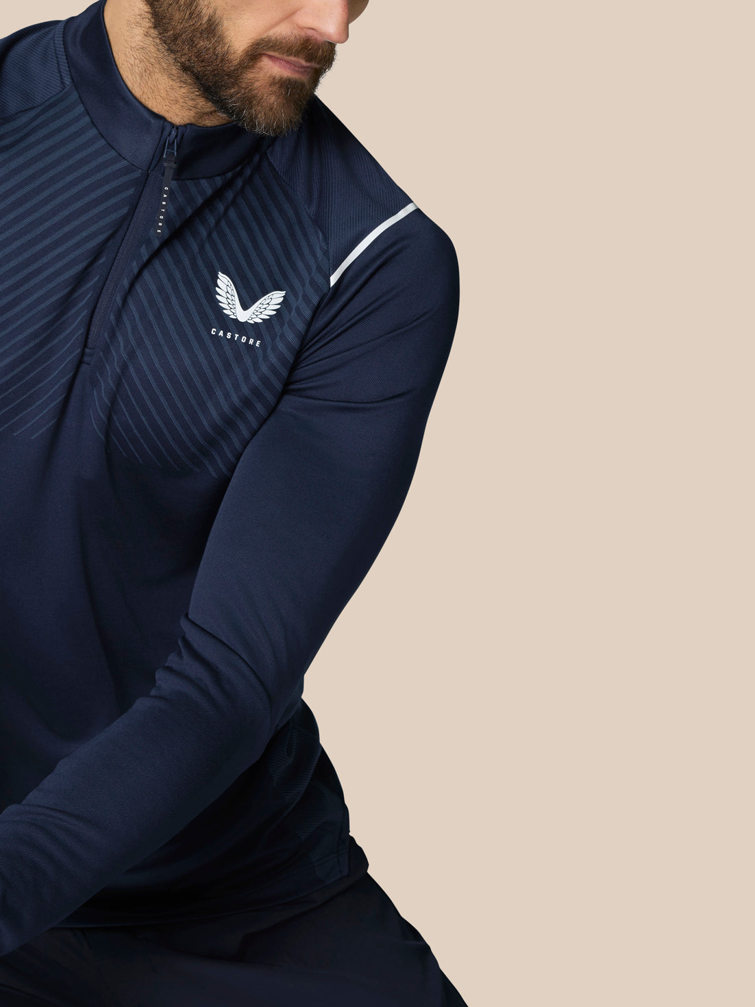 Front view of navy Pinnacle LVS 1/4 Zip Top with zip neck and diagonal striped chest panel and left chest logo