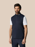 Navy club classic half zip gilet worn by a man, front view with Castore logo at the collar