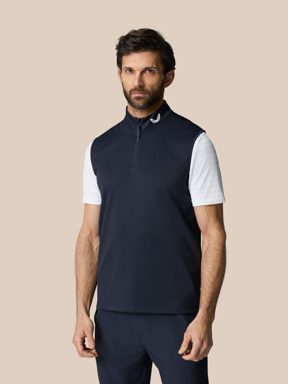 Navy club classic half zip gilet worn by a man, front view with Castore logo at the collar