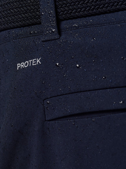 Close-up of navy ProTek water resistant fabric with a belt loop and droplets on the surface.