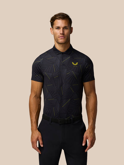 Model wearing Golf Club Swing Printed Polo in black with abstract striped pattern and yellow Castore logo on the chest