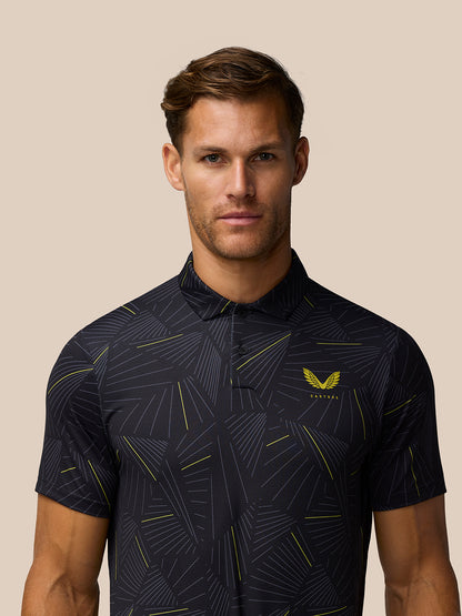 Close up of male model in black Golf Club Swing Polo showing the geometric line print and left chest logo