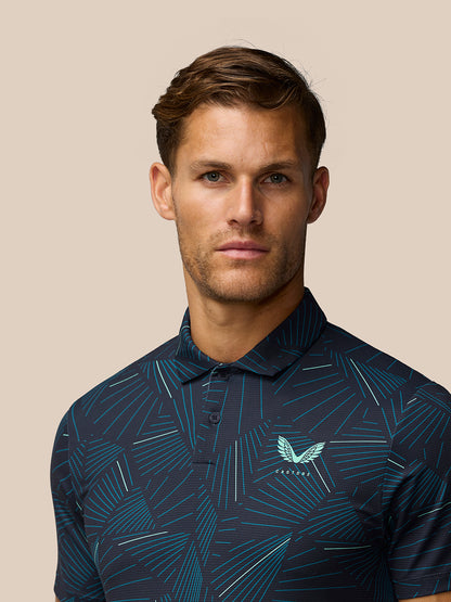 Close-up of man wearing Golf Club Swing Printed Polo with aqua Castore logo on left chest