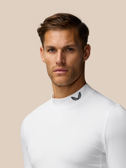 Close up of male model in white Golf Club Thermal Mock Neck top showing midnight navy branding at the neck