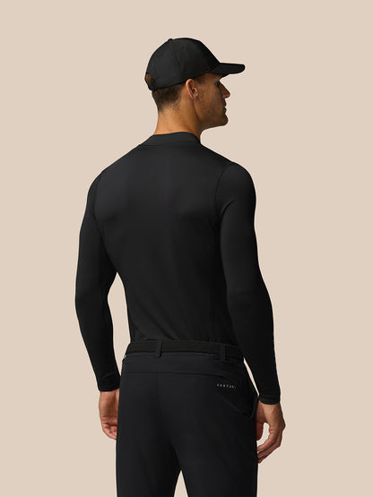 Back view of a man wearing the black Golf Club Long Sleeve Thermal Mock Neck top showing Castore branding at neck and arm