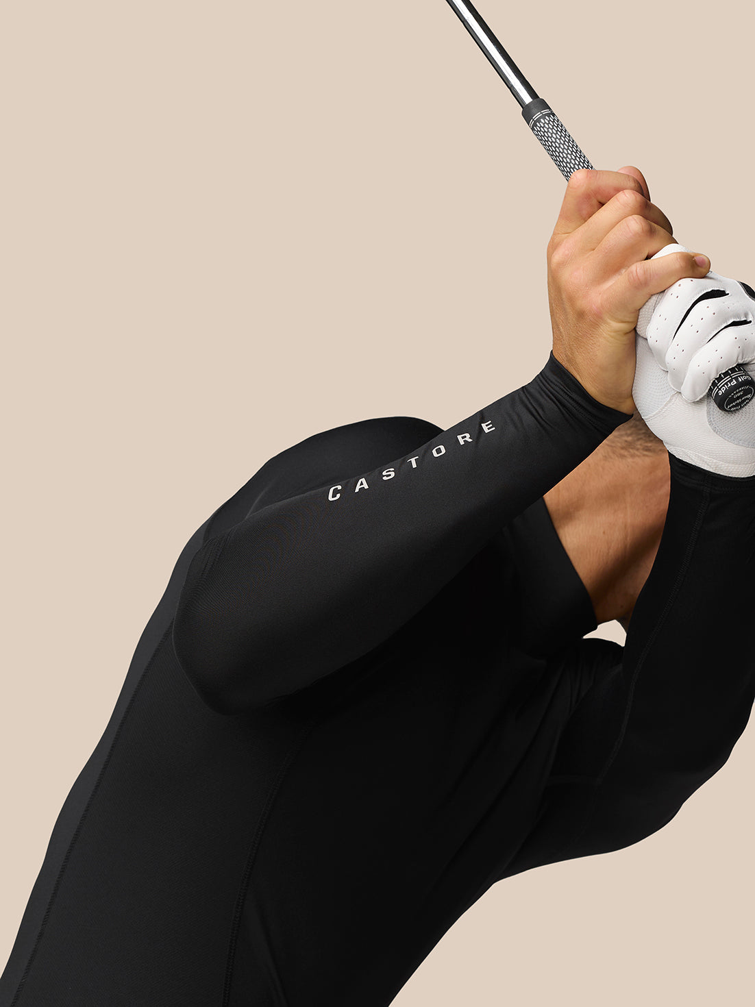 Side view of black Golf Club Thermal Long Sleeve top on a model showing a fitted silhouette and branding at neck