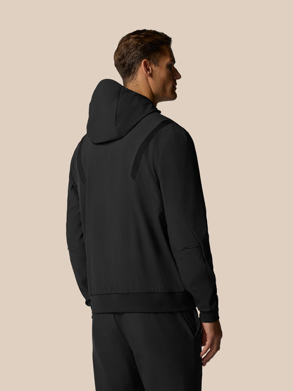 Back view of a man in black Golf Pinnacle Performance Hoodie with hood up