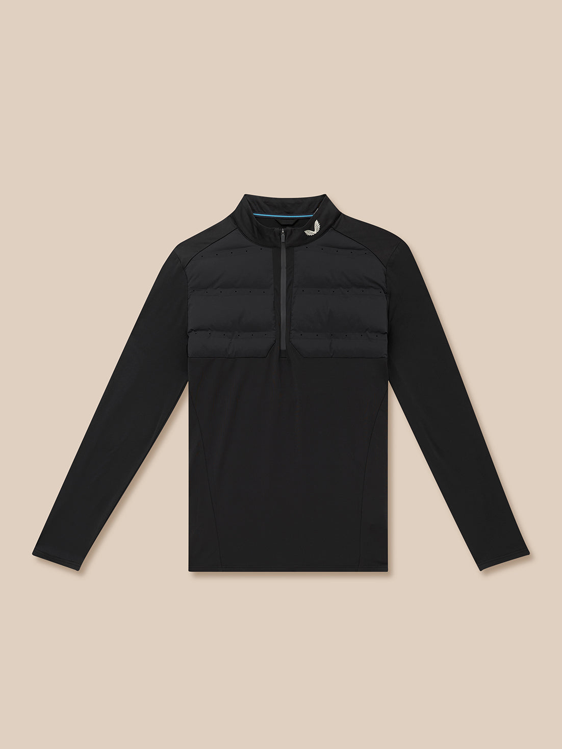 Black half-zip golf top with quilted chest panels and Castore branding at the neck