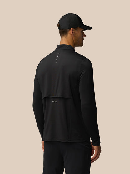 Back view of man in black LVS Hybrid top showing ventilation signifier on back and neck logo