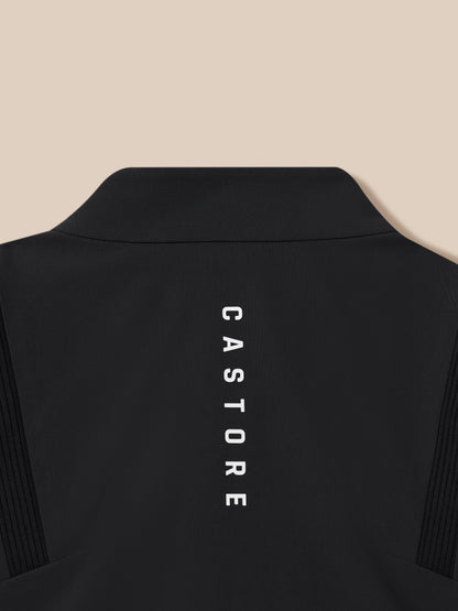 Close up of the black Golf Pinnacle LVS jacket neck area with textured fabric and vertical Castore branding.