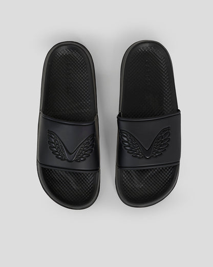Top view of black Castore sliders showing embossed wing emblems on the straps and the word logo along the sides