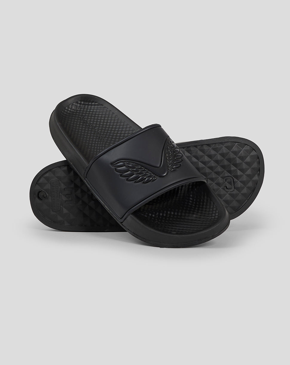 Angled view of a single black Castore slider with embossed wing emblem on the strap