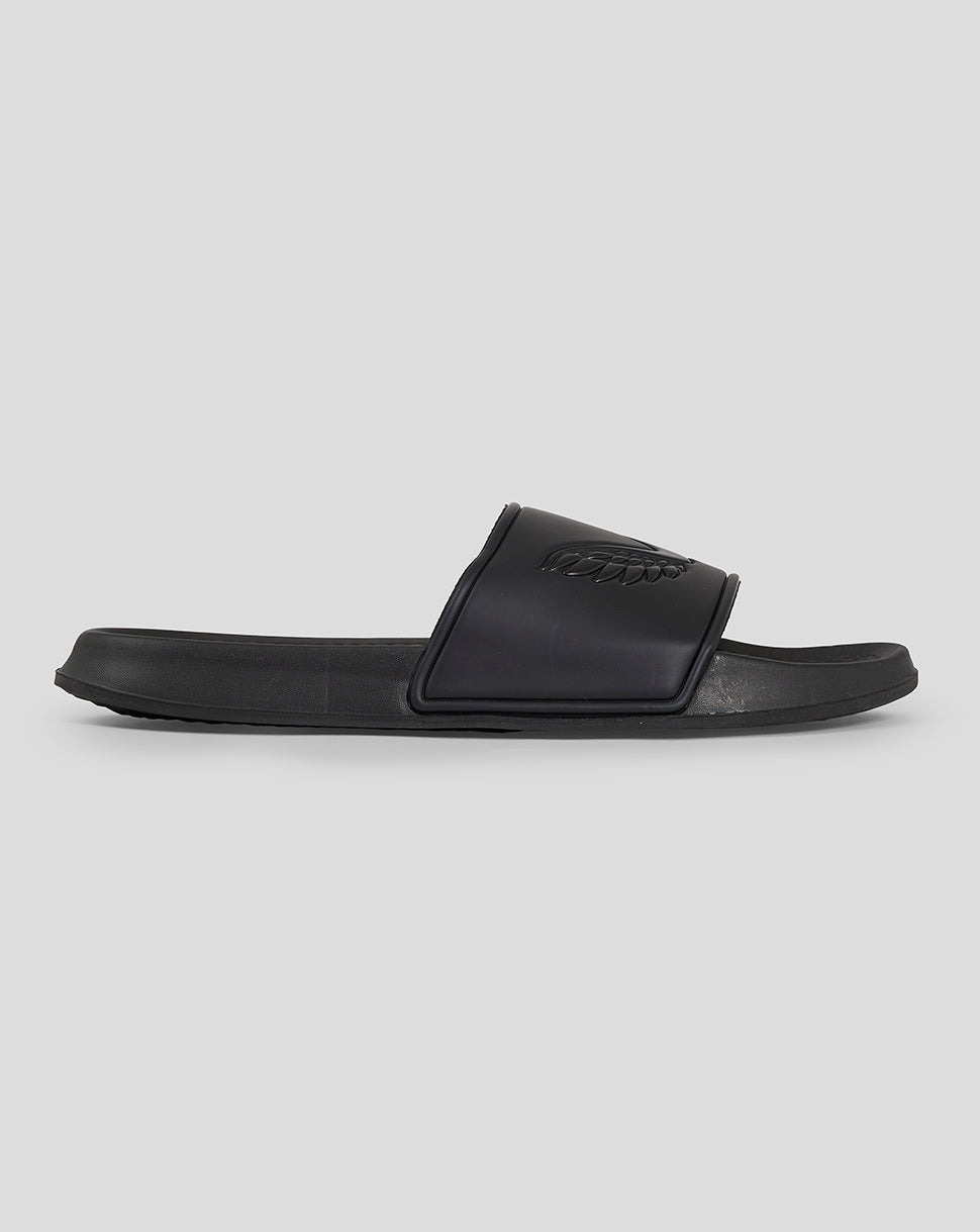 Side view of black Castore Slider Caviar sandal with embossed wing logo on the strap