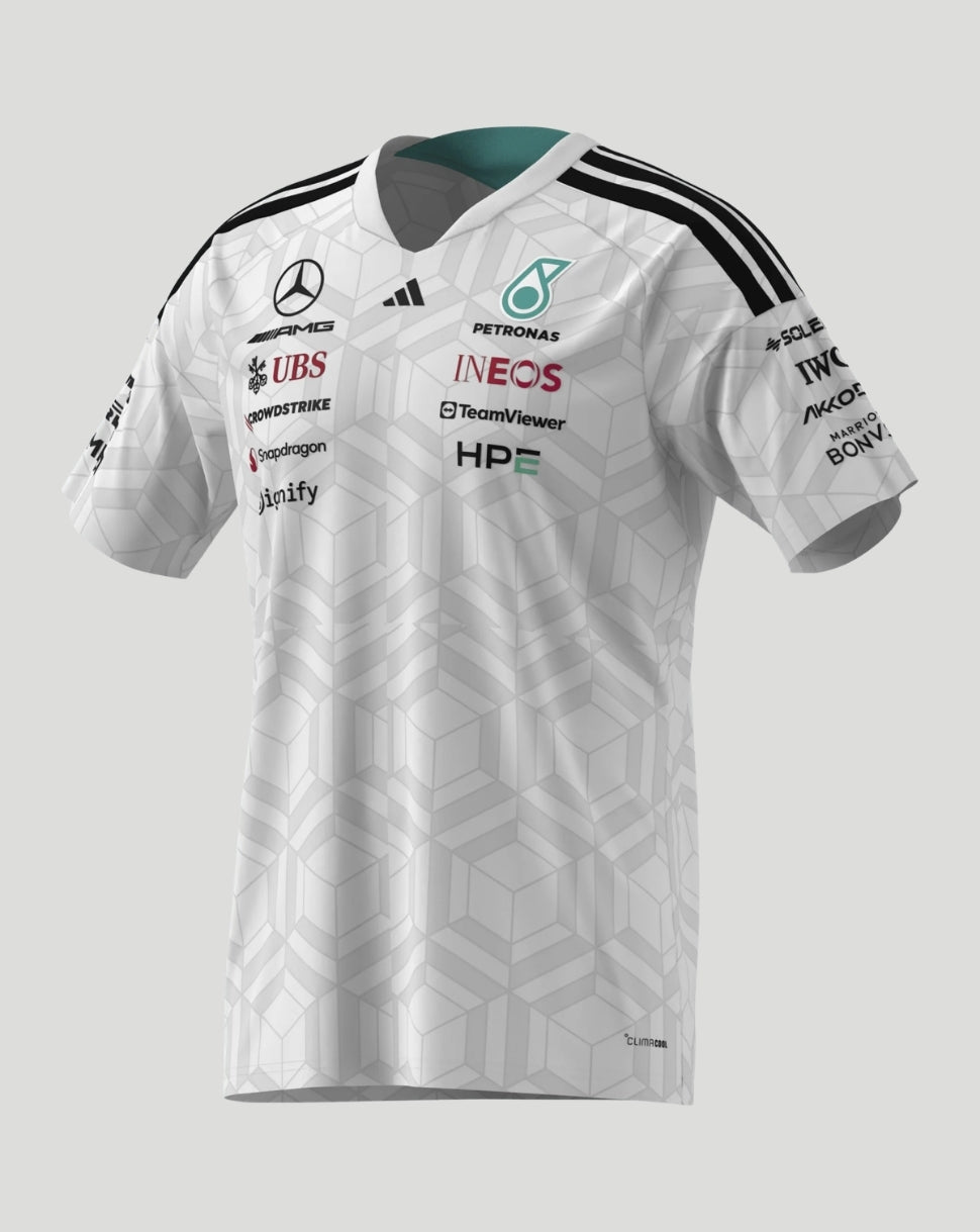 Angled front view of white Mercedes AMG Petronas F1 Team men's driver T-shirt with geometric pattern and sponsor logos