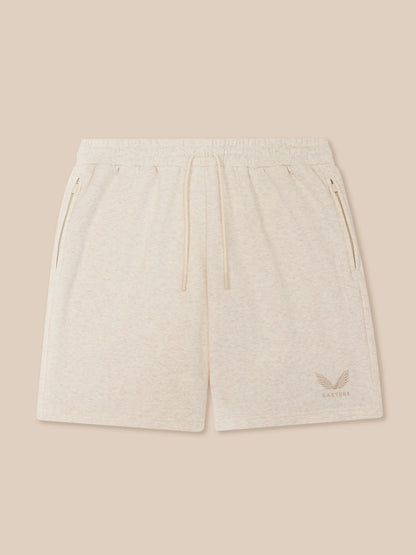 Cream Men's Adapt Cotton Fleece shorts with elastic waistband drawcord, zip pockets and Castore logo on the leg.