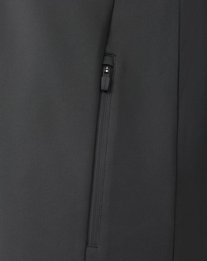 Close up of black zip detail on a quarter zip sweatshirt with visible zipper pull