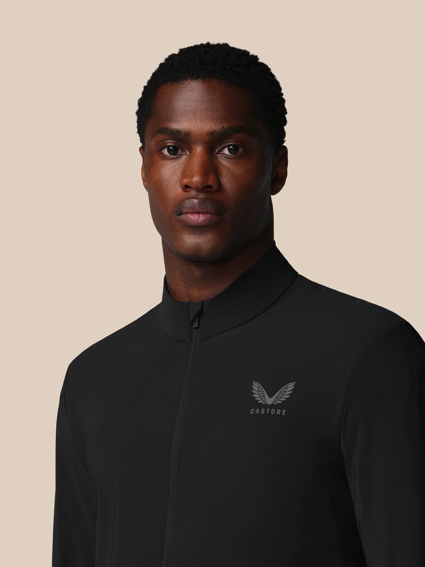 Black Men’s Flex Long Sleeve Tech Training Jacket with stand collar full zip pockets and Castore logo on left chest