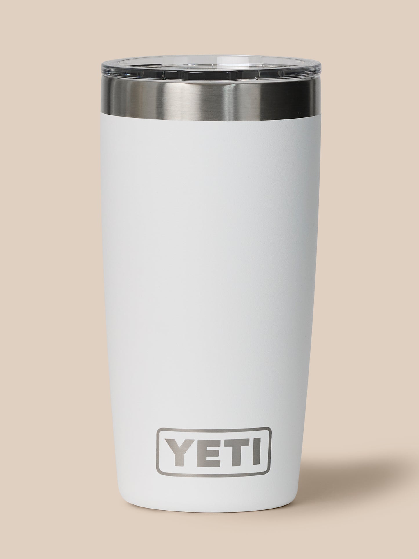 White YETI Castore tumbler with stainless steel lip and lid removed, logo visible on the body.