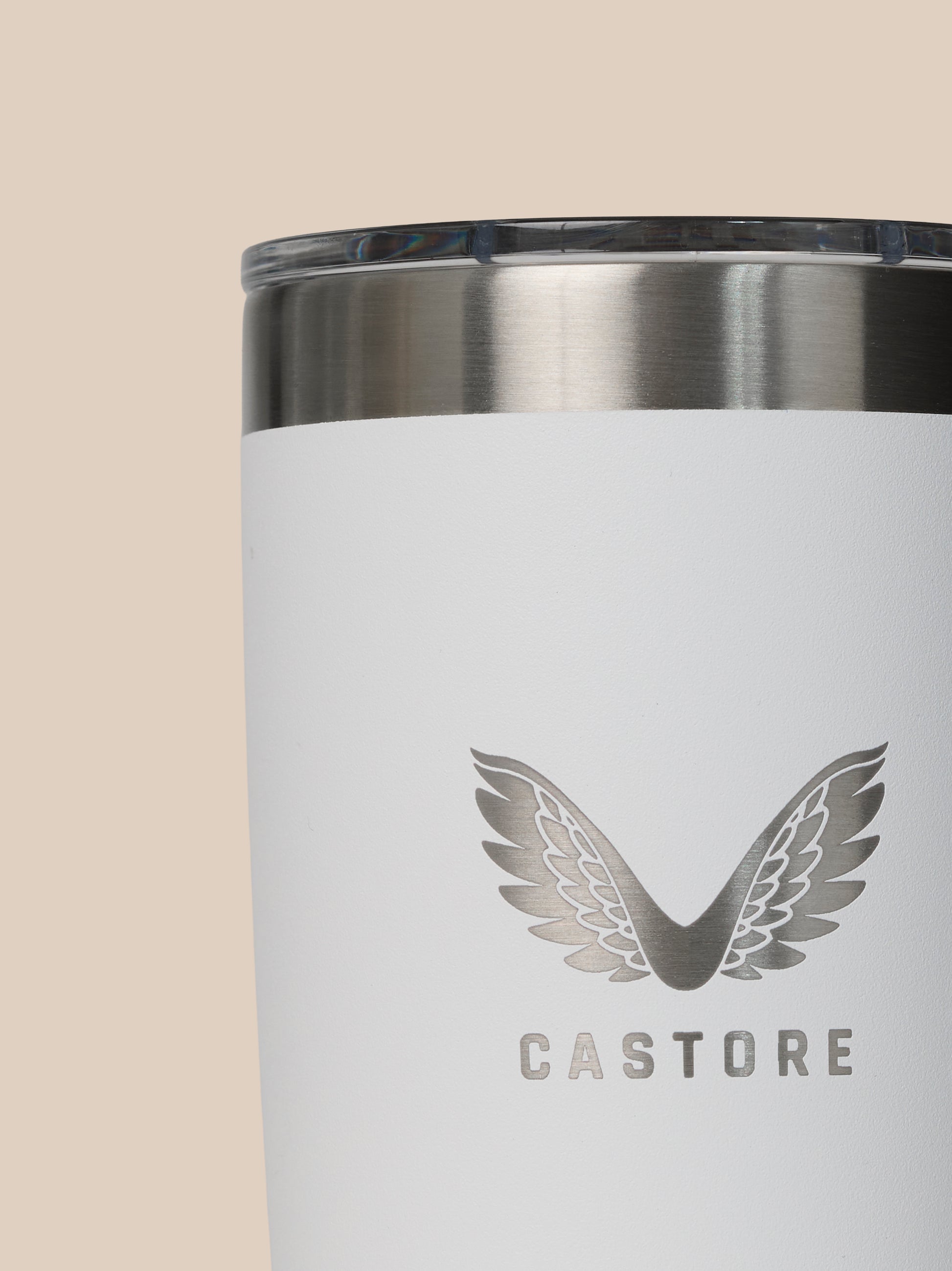 Close-up of YETI x Castore 300ml tumbler rim showing a brushed stainless band on a white body with partial Castore logo