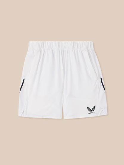 White shorts with black logo on a beige background