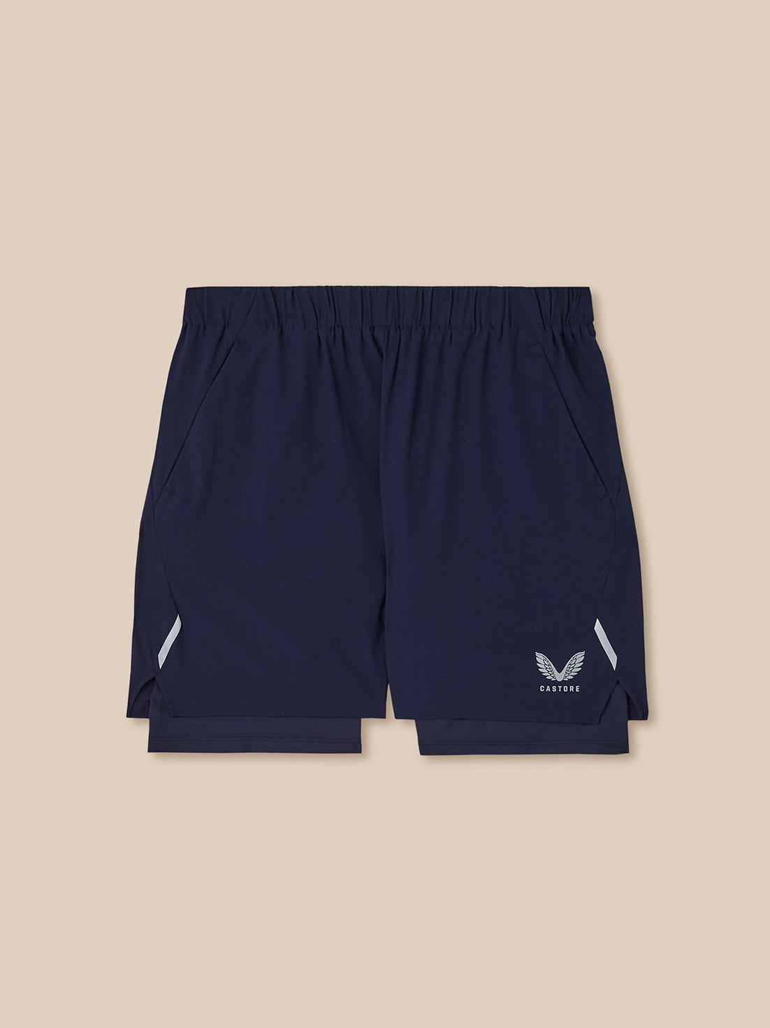 Navy blue shorts with a logo on a beige background