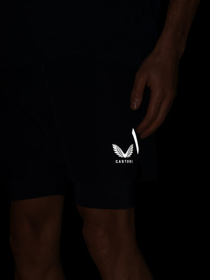 Black shorts with a white logo on a dark background