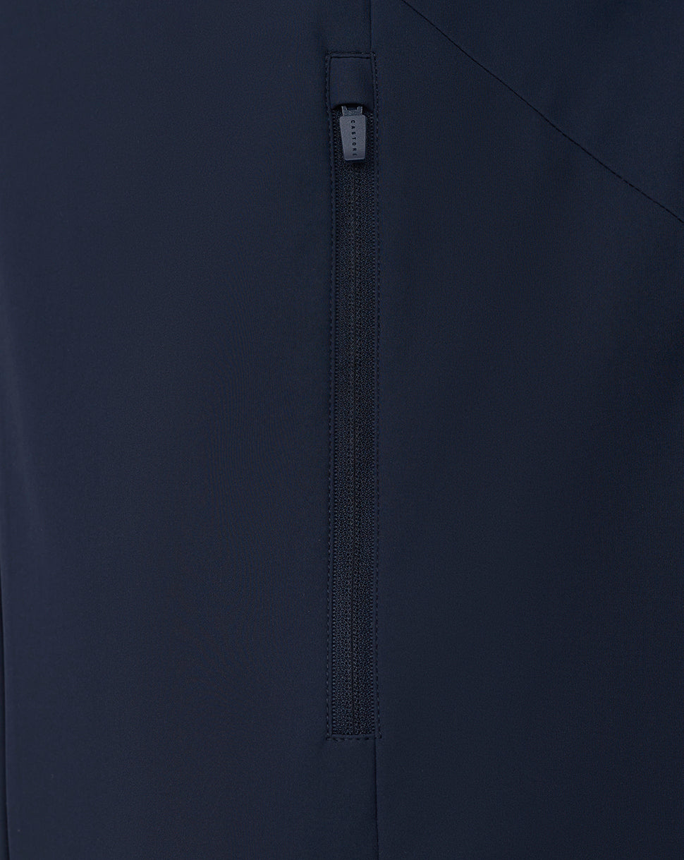 Close up of navy LVS jacket showing vertical zip pocket with dark pull