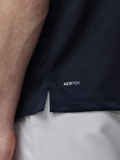 Navy LVS Engineered Knit Short Sleeve Polo Top laid flat with AERTEK branding at the hem