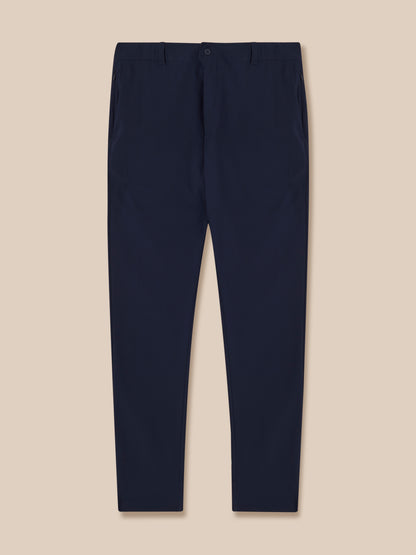 Navy men's golf trousers back view showing rear pockets and Castore branding