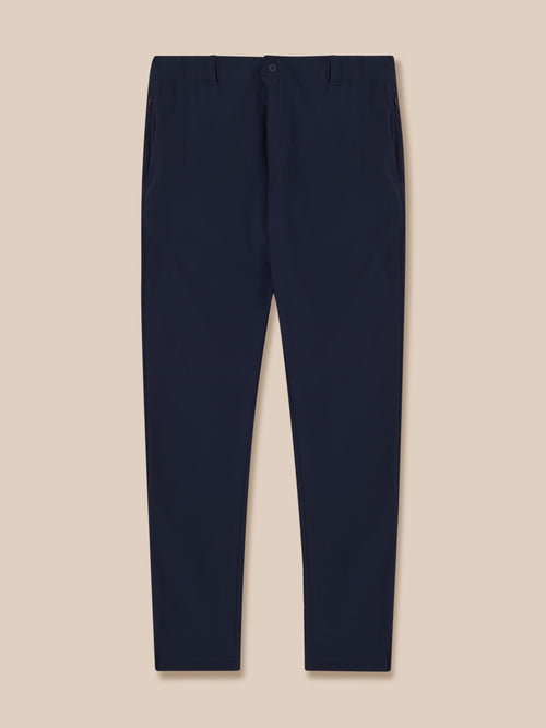 Navy men's golf trousers back view showing rear pockets and Castore branding