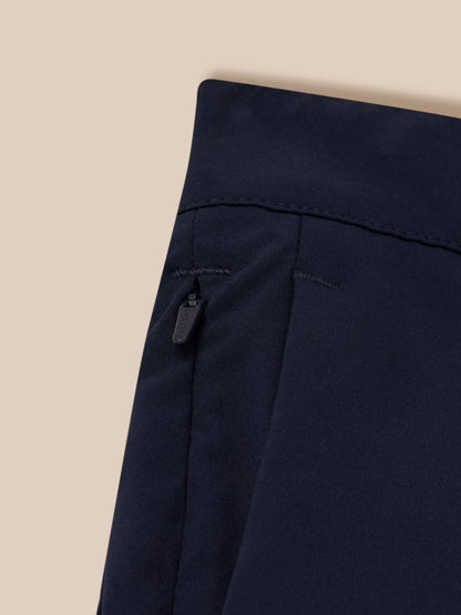 Close up of navy golf trousers waistband showing curved edge and stitching detail